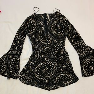 Sage clothing black romper with scalloped sleeves